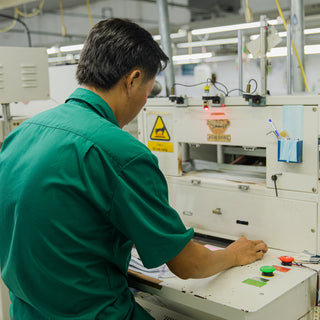 Worker operating garment machine
